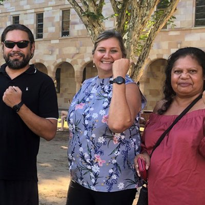 Sleep coaches Jamie Dunne and Karen Chong and Cultural Advisor Roslyn Von Senden hold up monitoring watches